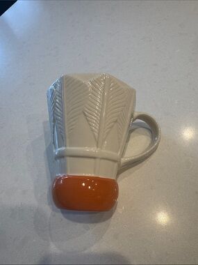 Shuttlecock mug Nelson’s Atkins Museum  birdie Cream Ceramic Mug.